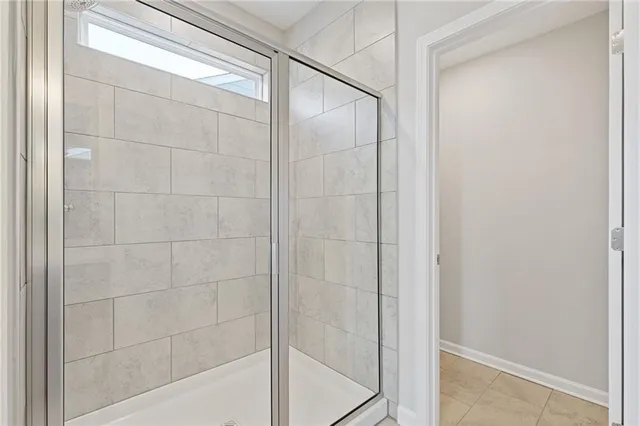 a bathroom with a granite countertop toilet a sink and a bathtub