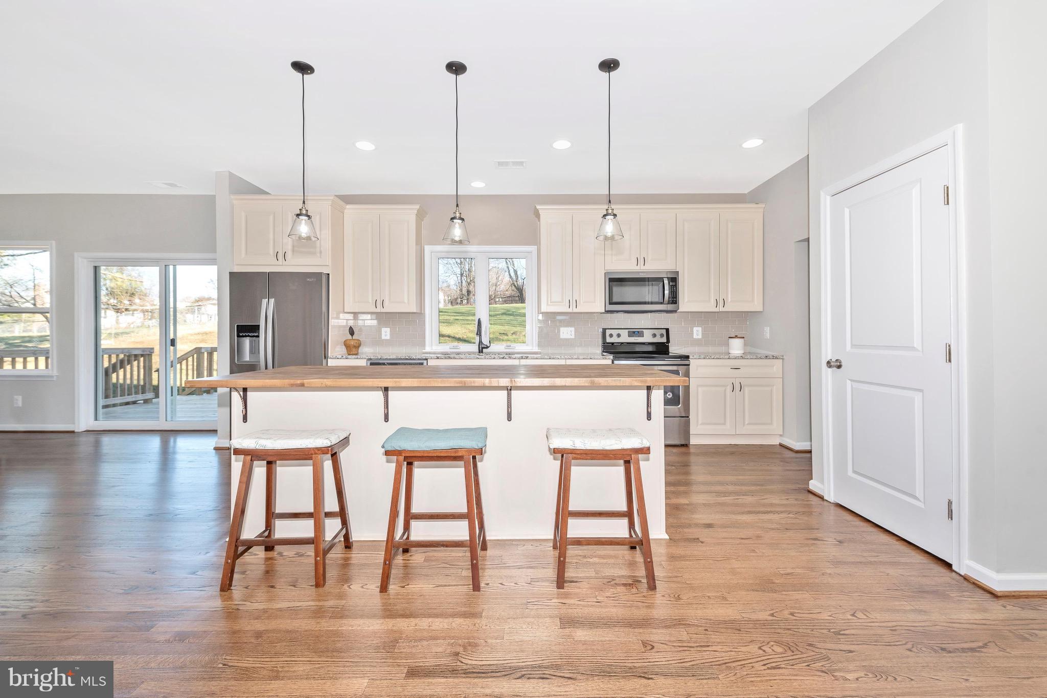 5411 Sidney Road Mount Airy, MD 21771 - Photo 8 of 32 Open custom kitchen with large island.