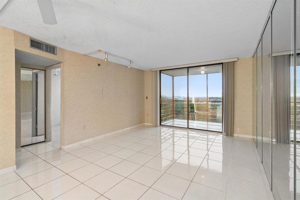 1200 St Charles Place, Unit PH7 Pembroke Pines, FL 33026 - Photo 12 of 28 a view of an empty room and window