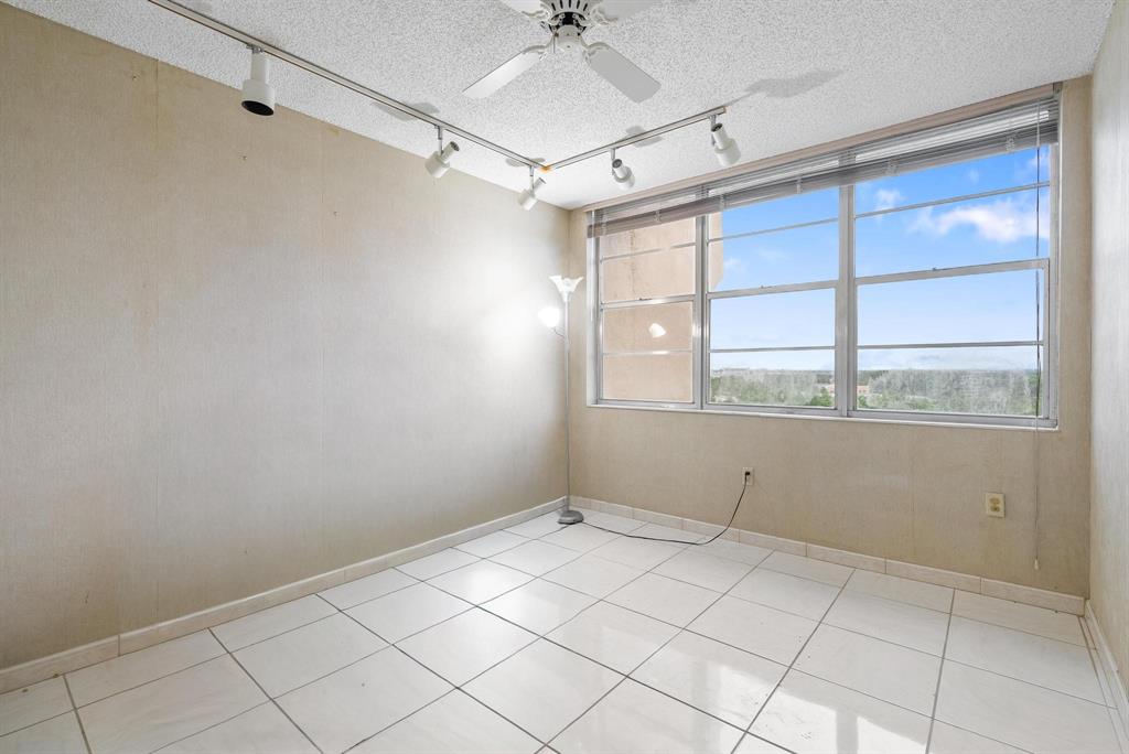 1200 St Charles Place, Unit PH7 Pembroke Pines, FL 33026 - Photo 4 of 28 a view of an empty room with a window
