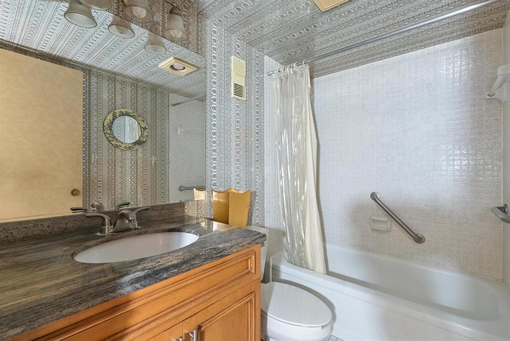 1200 St Charles Place, Unit PH7 Pembroke Pines, FL 33026 - Photo 5 of 28 a bathroom with a granite countertop sink and a mirror