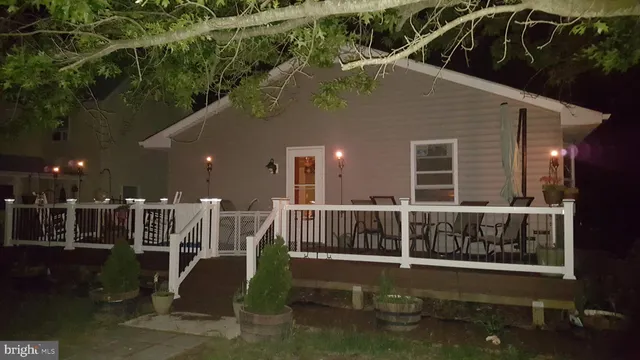 a balcony with table and chairs