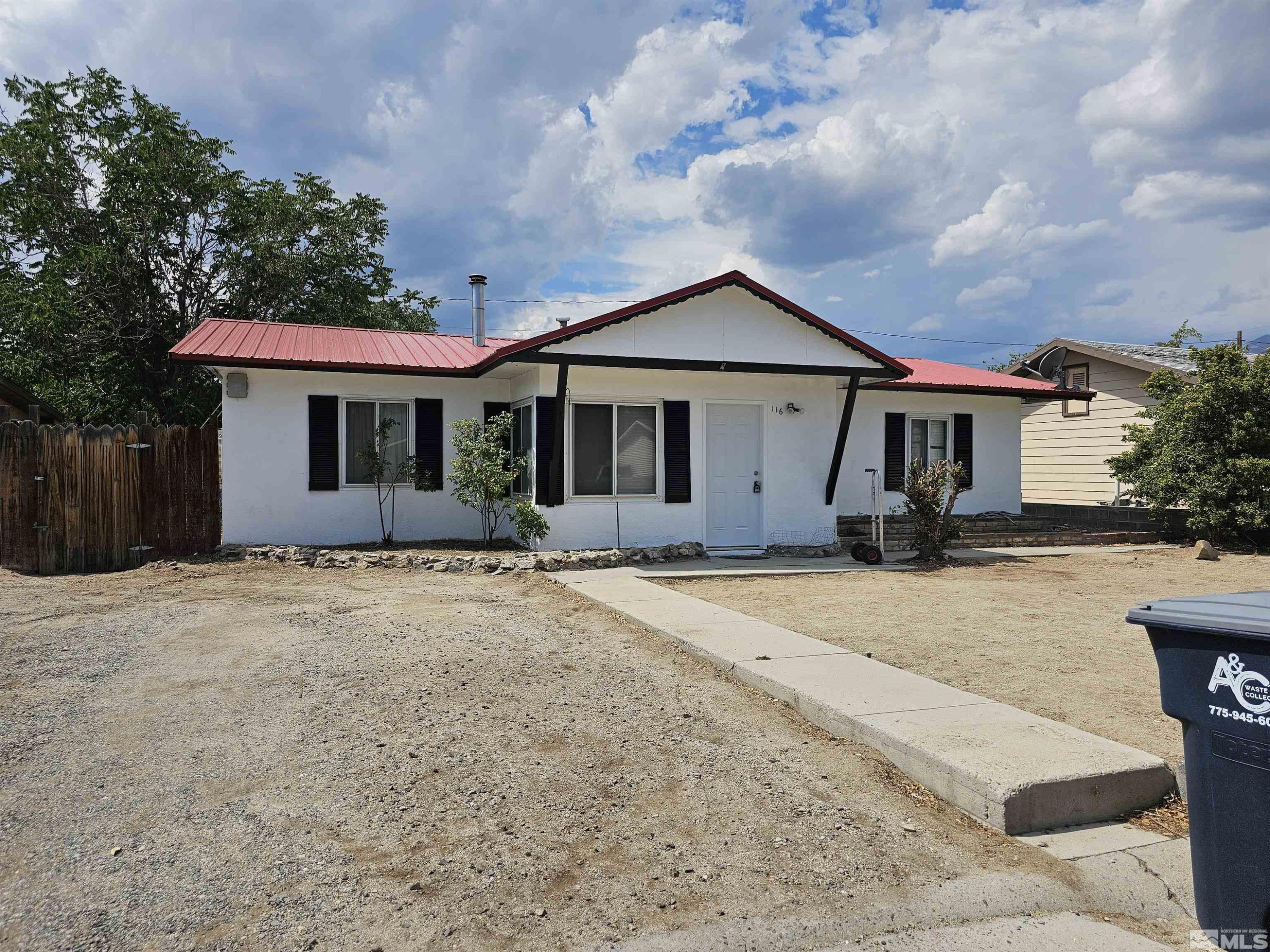 116 English Street Hawthorne, NV 89415 - Photo 2 of 18 a front view of a house with a yard