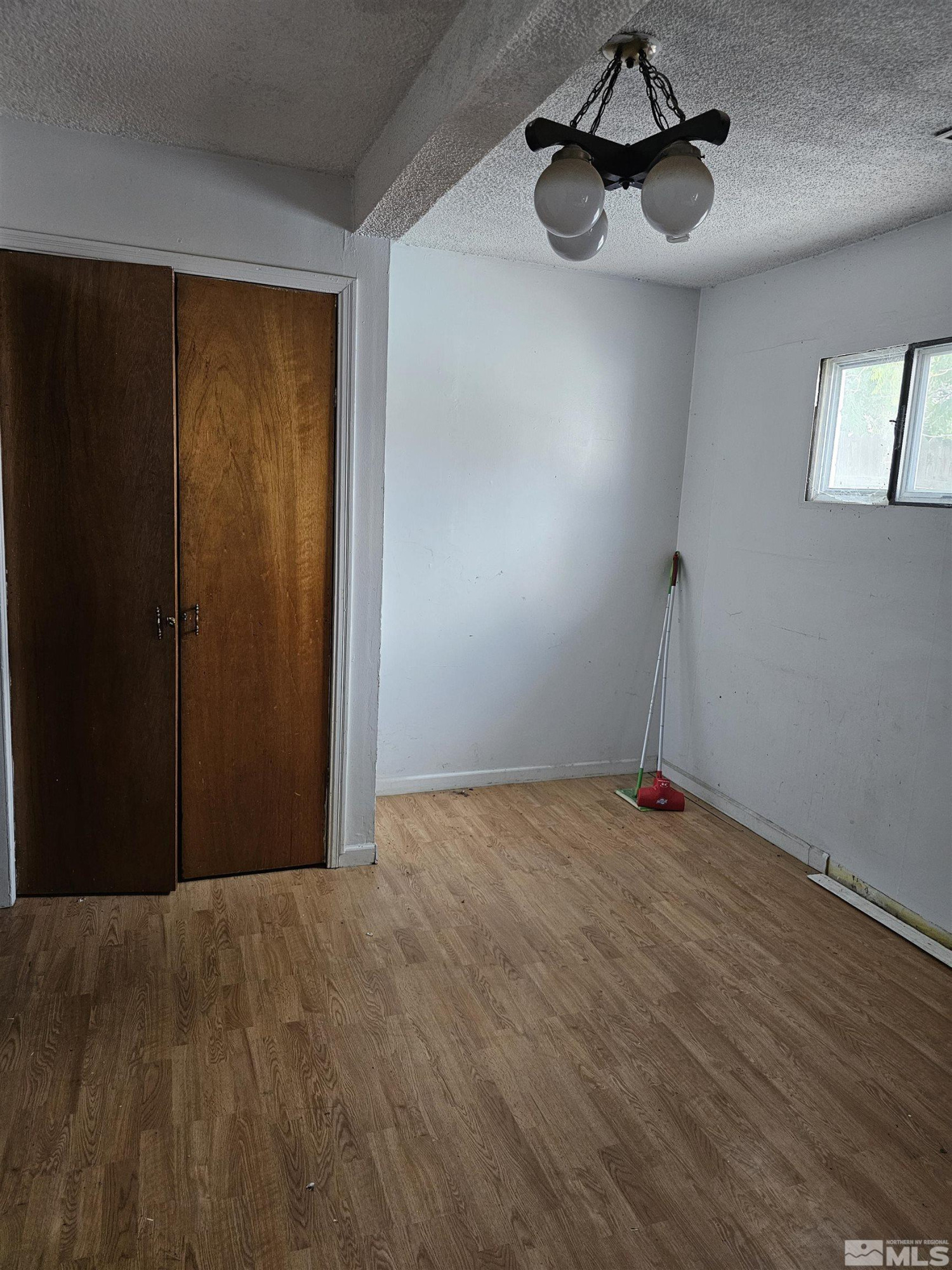 116 English Street Hawthorne, NV 89415 - Photo 5 of 18 a view of an empty room with a window