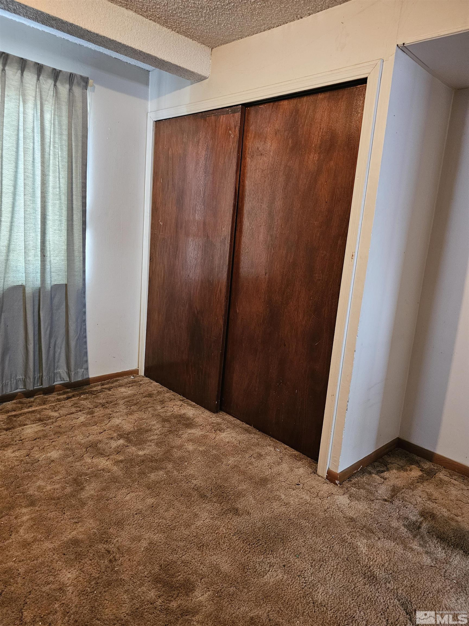 116 English Street Hawthorne, NV 89415 - Photo 7 of 18 a view of empty room with wooden floor