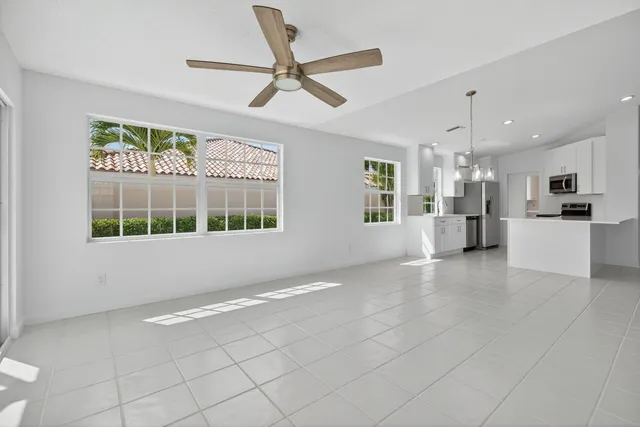 a view of a kitchen with a sink and a window