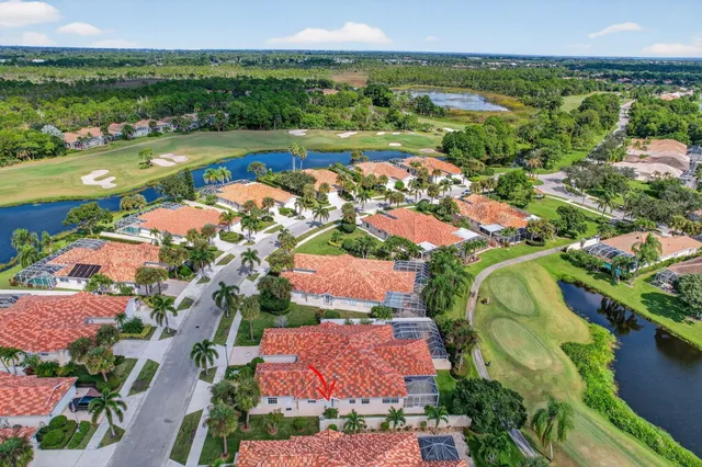 an aerial view of house with yard swimming pool and outdoor seating