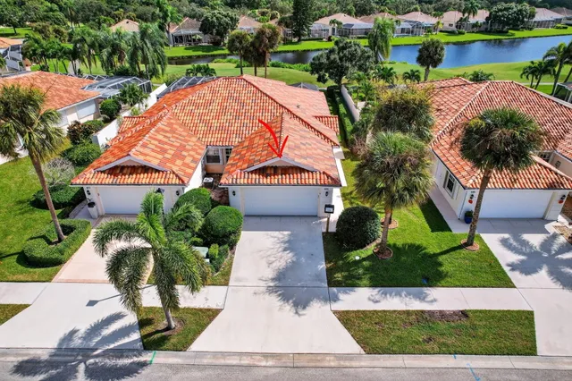 a view of multiple houses with yard