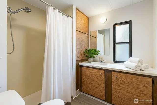 an empty room with windows and closet