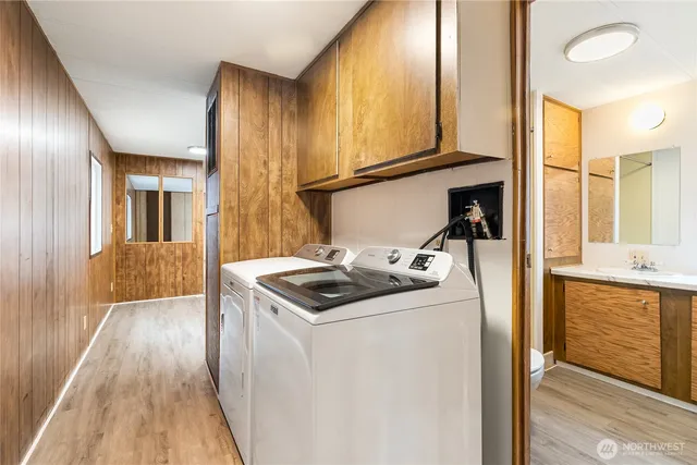 a view of a green field with trees in the background