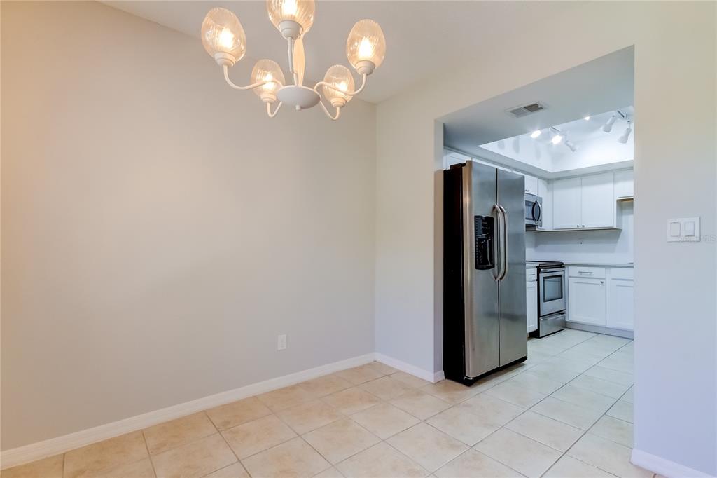 1801 East Lake Road South, Unit 12C Palm Harbor, FL 34685 - Photo 14 of 24 a view of kitchen and refrigerator