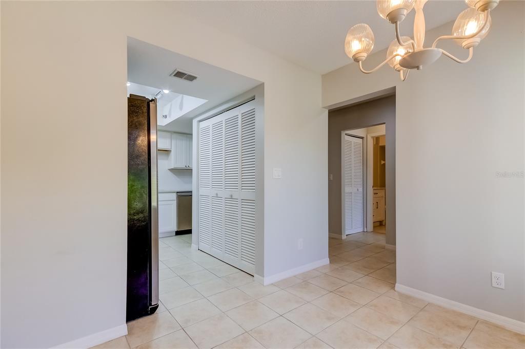 1801 East Lake Road South, Unit 12C Palm Harbor, FL 34685 - Photo 15 of 24 a view of a hallway with wooden shelves