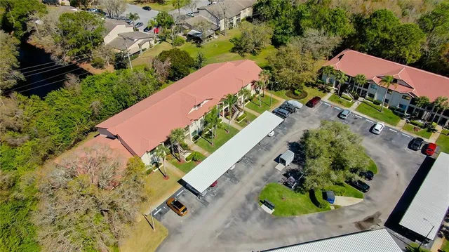 an aerial view of a house with a yard and garden