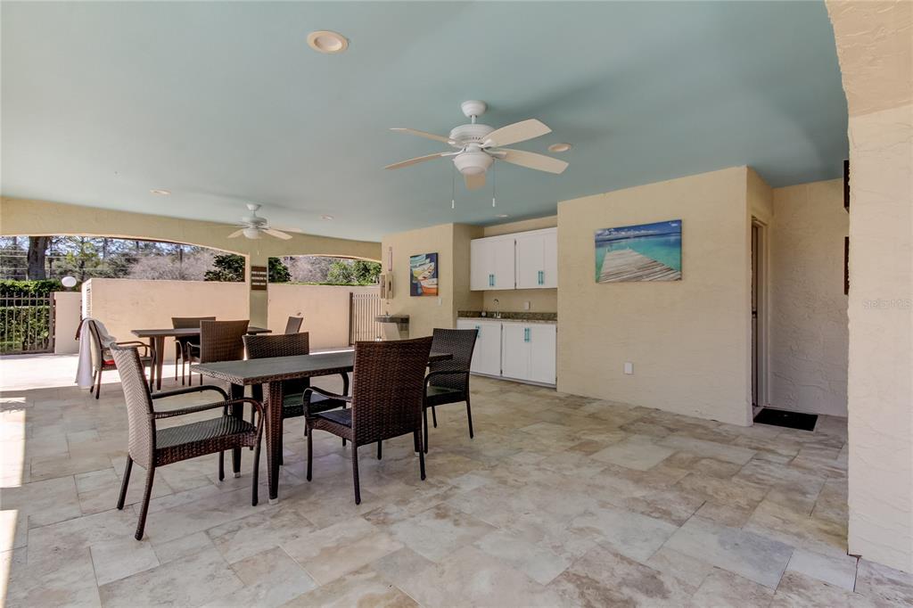 1801 East Lake Road South, Unit 12C Palm Harbor, FL 34685 - Photo 6 of 24 a view of a dining room with furniture