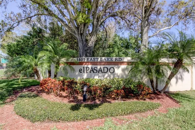 a view of sign board and green space