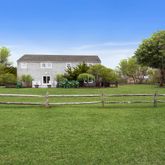 a view of a golf course with a houses