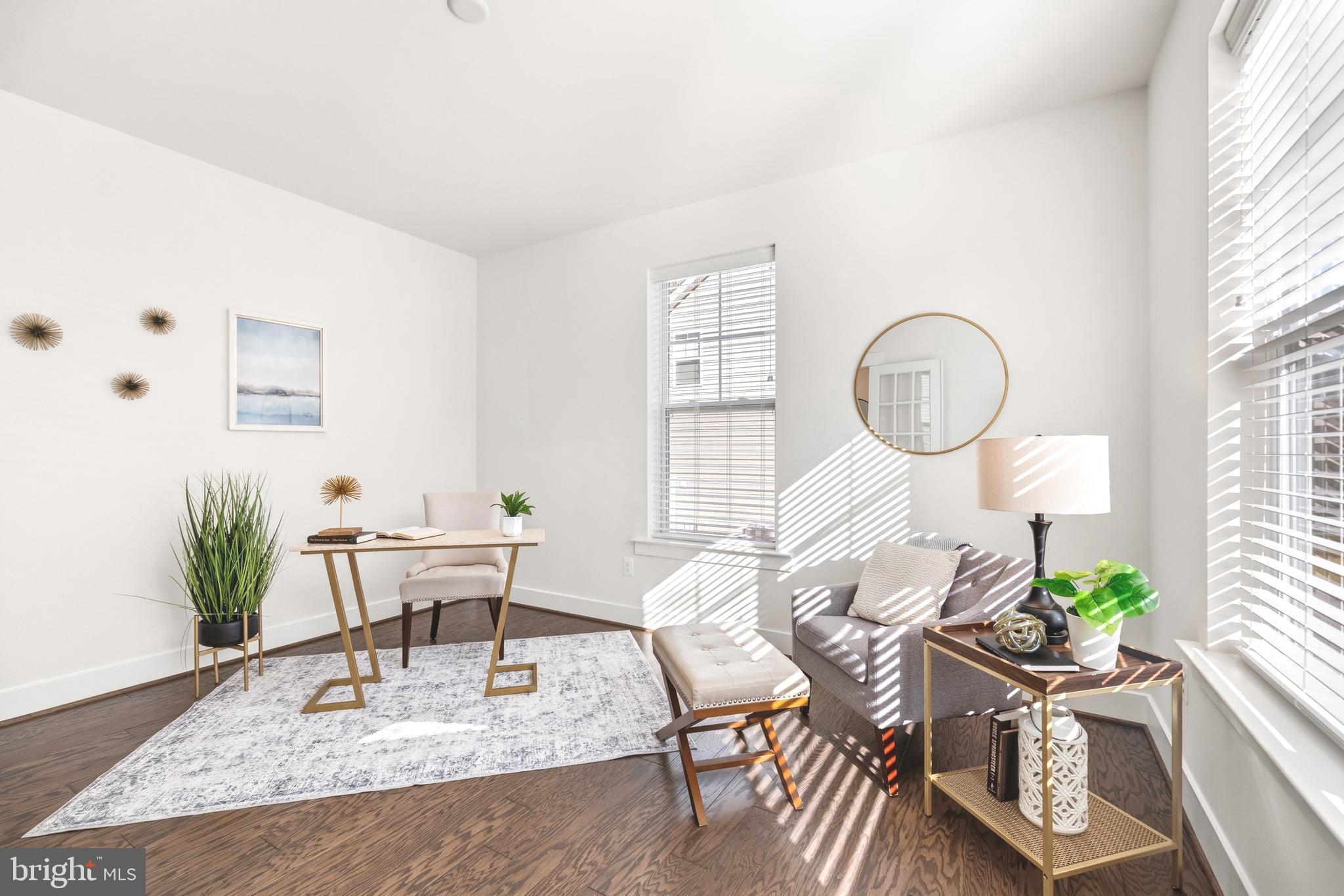 550 Broadneck Road Annapolis, MD 21409 - Photo 16 of 63 a living room with furniture a rug and a large window