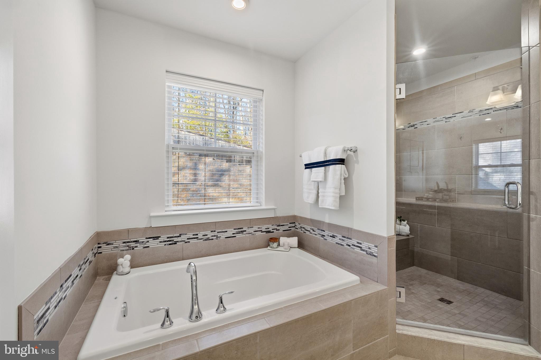 550 Broadneck Road Annapolis, MD 21409 - Photo 26 of 63 a bathroom with a bathtub and a shower
