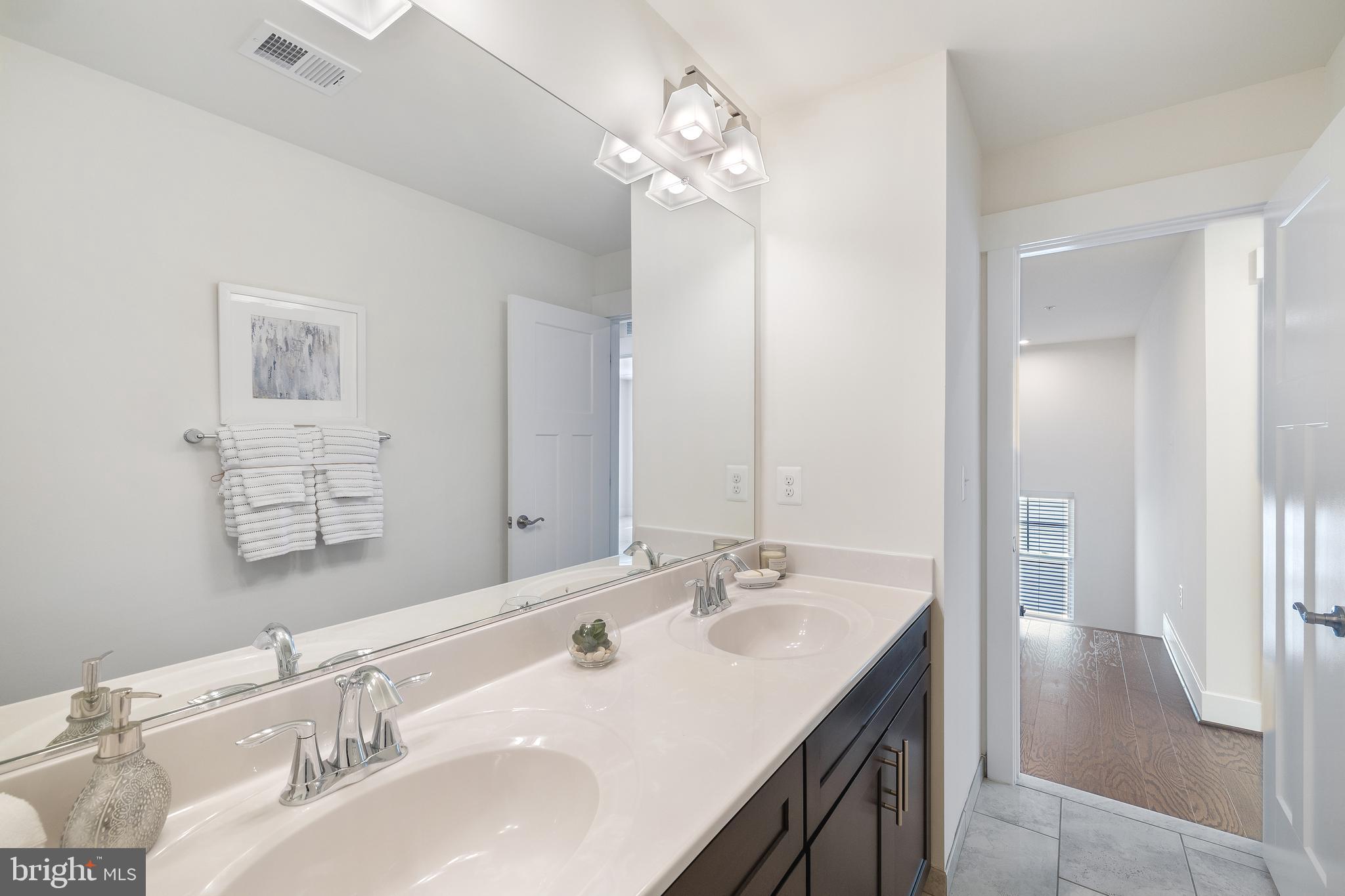 550 Broadneck Road Annapolis, MD 21409 - Photo 36 of 63 a bathroom with a sink double vanity and a mirror