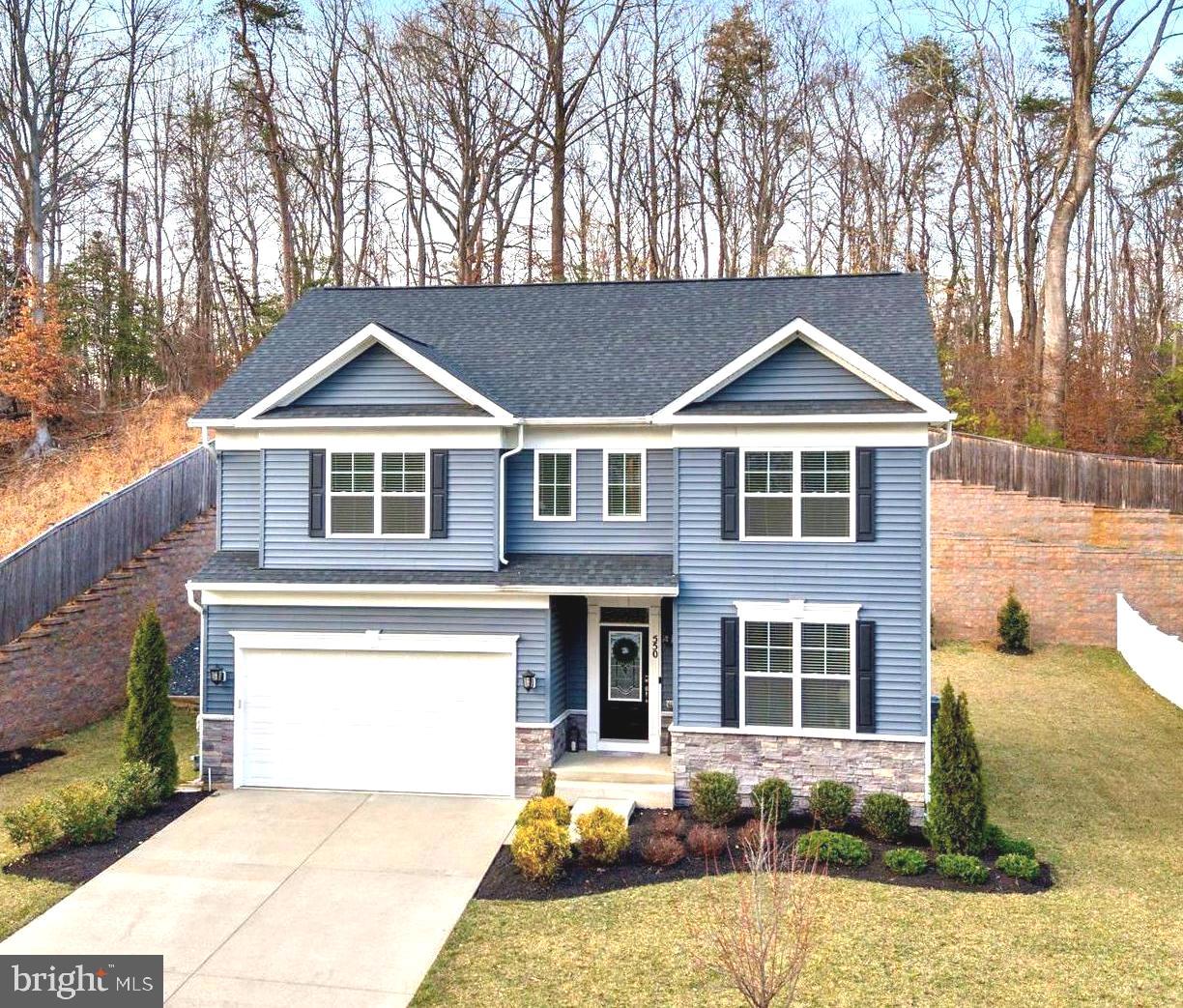 550 Broadneck Road Annapolis, MD 21409 - Photo 61 of 63 a front view of a house with a yard