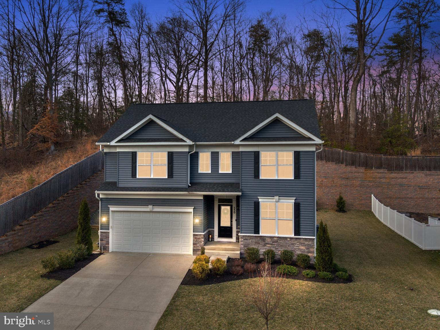 550 Broadneck Road Annapolis, MD 21409 - Photo 63 of 63 a front view of a house with yard garage and outdoor seating