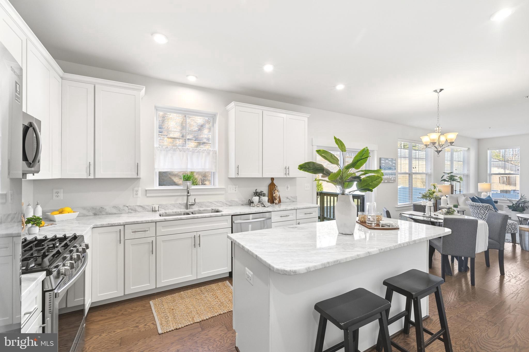 550 Broadneck Road Annapolis, MD 21409 - Photo 9 of 63 a kitchen with a sink table and chairs