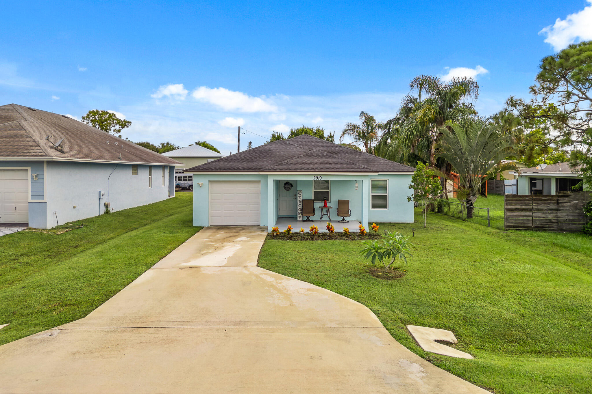 a front view of a house with a garden and porch