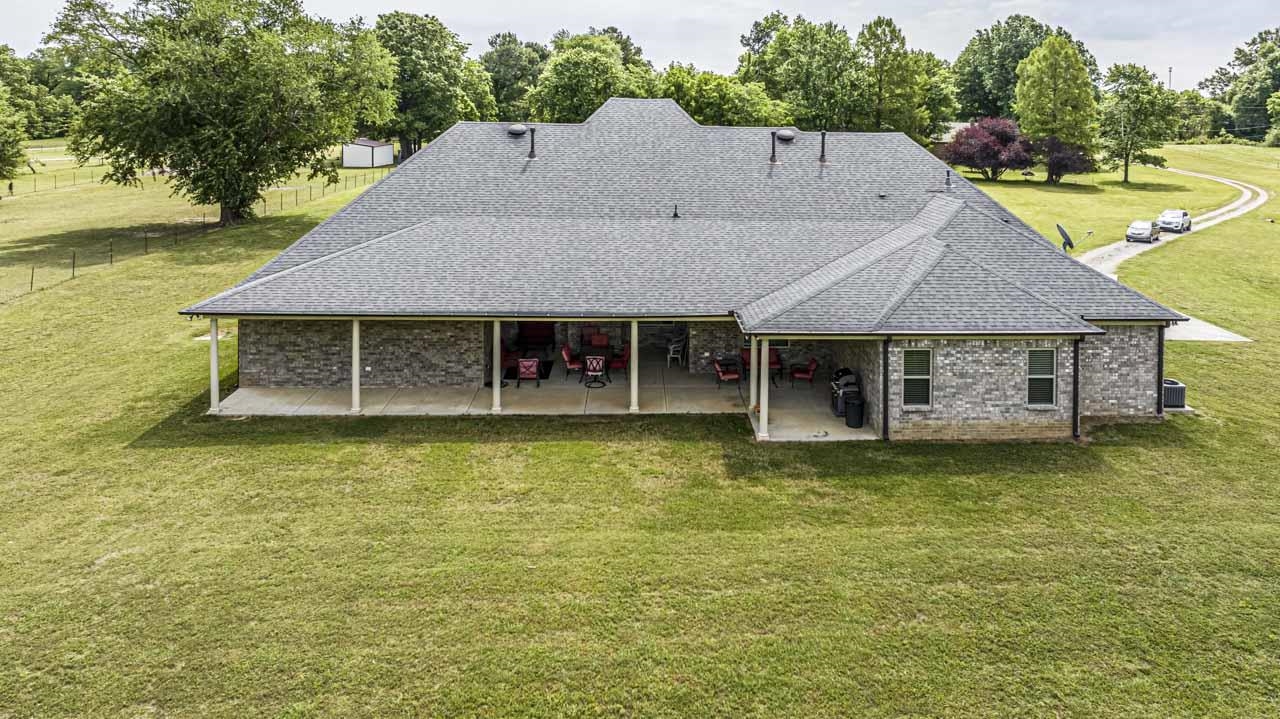 185 Belmont Road Mason, TN 38049 - Photo 33 of 40 a aerial view of a house with swimming pool and large trees