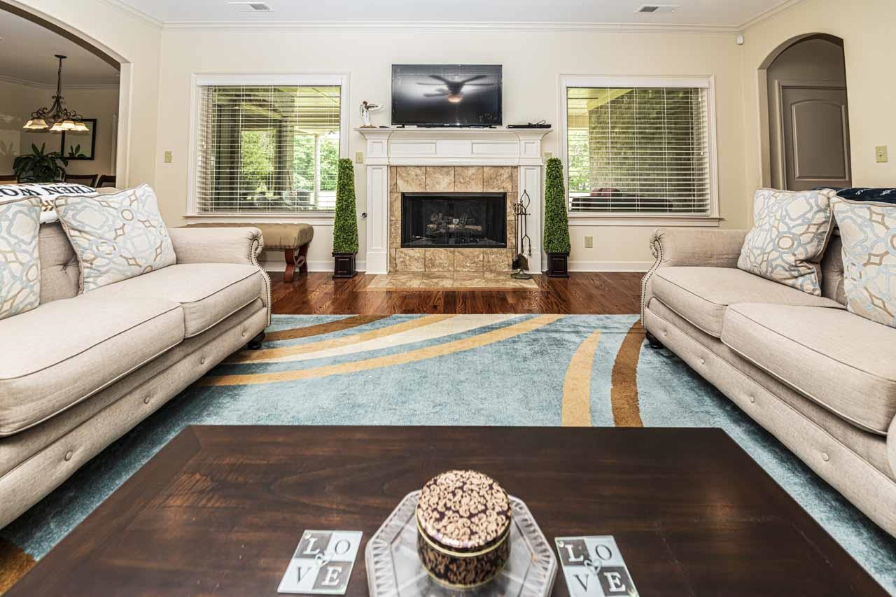 185 Belmont Road Mason, TN 38049 - Photo 7 of 40 a living room with furniture and a fireplace