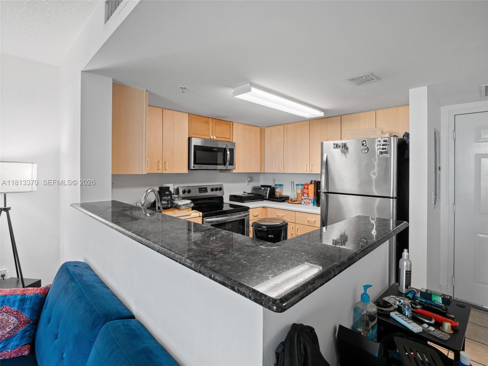 3000 Coral Way, Unit 815 Miami, FL 33145 - Photo 13 of 41 KITCHEN WITH NEWER STAINLESS STEEL APPLIANCES