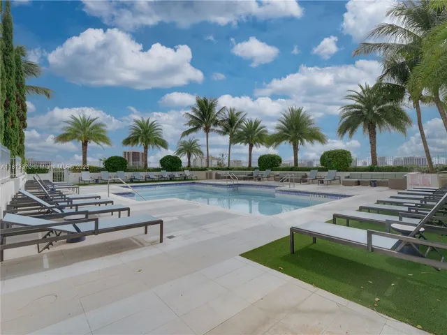 a view of swimming pool with outdoor seating