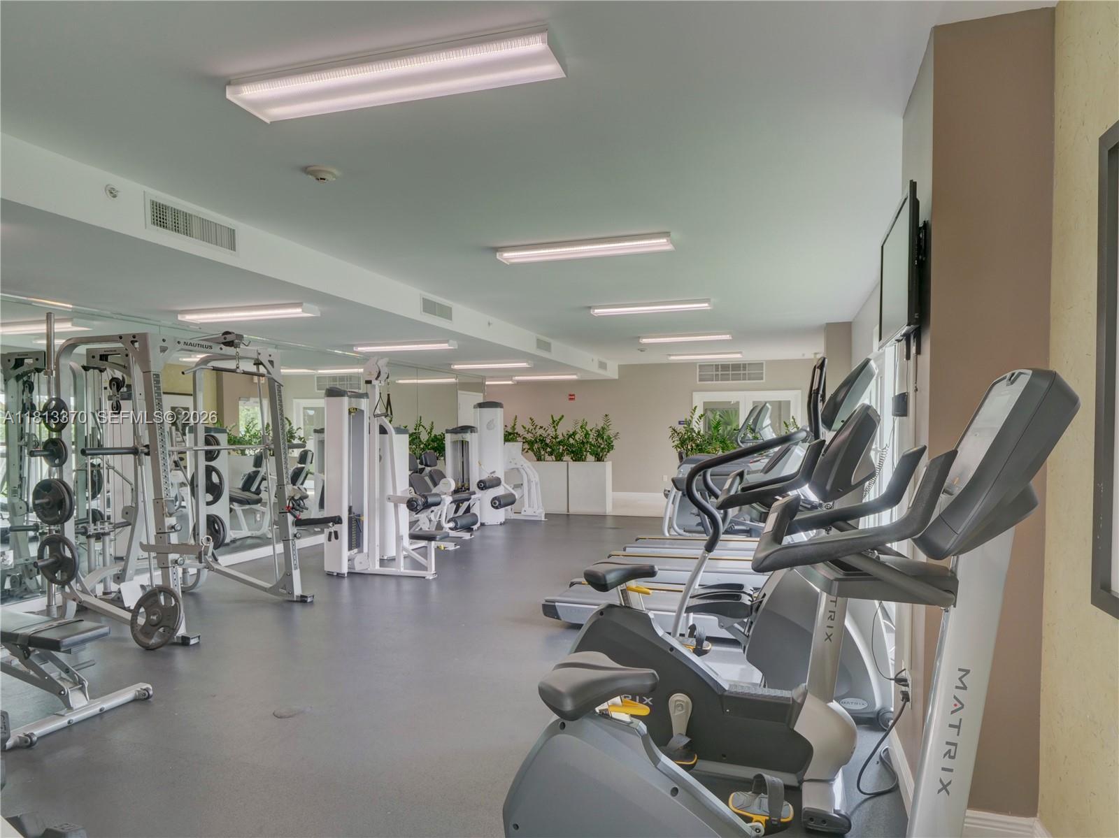 3000 Coral Way, Unit 815 Miami, FL 33145 - Photo 24 of 41 RENOVATED GYM OVERLOOKING THE LOVELY GARDEN