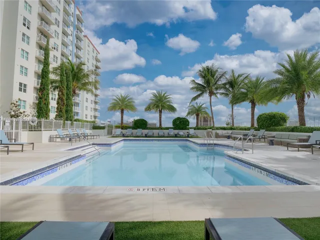a view of outdoor space with swimming pool and lounge chair