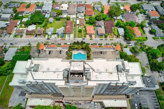 an aerial view of residential houses with outdoor space