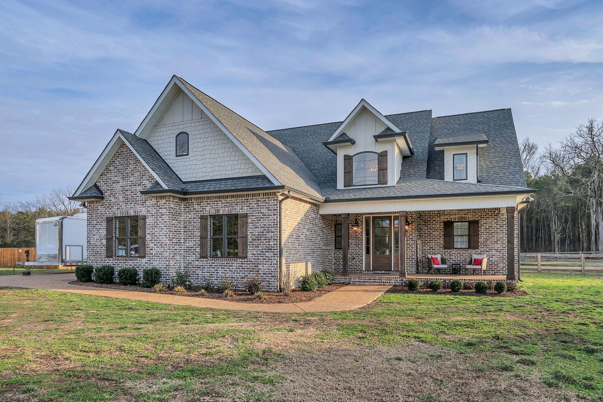 6655 Simmons Bluff Road Lebanon, TN 37090 - Photo 1 of 32 a front view of a house with garden