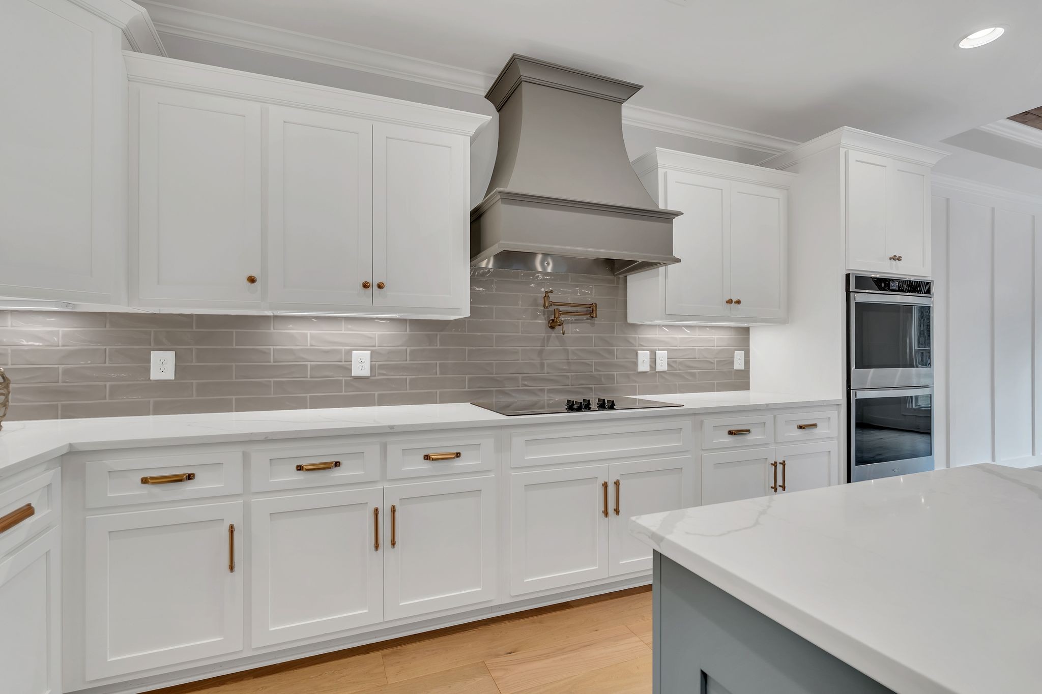 6655 Simmons Bluff Road Lebanon, TN 37090 - Photo 12 of 32 a kitchen with white cabinets and white appliances