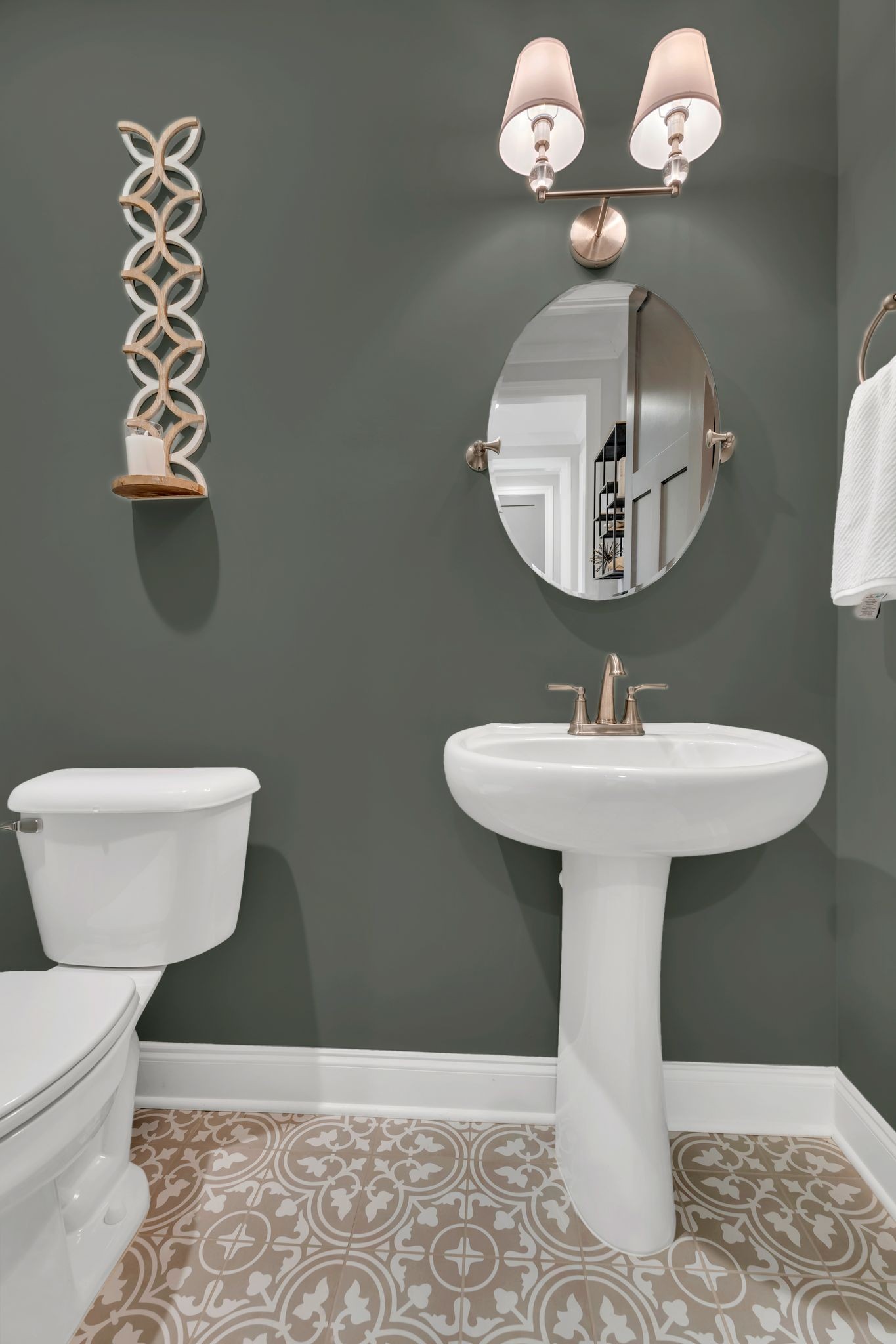 6655 Simmons Bluff Road Lebanon, TN 37090 - Photo 16 of 32 a bathroom with a toilet sink and mirror