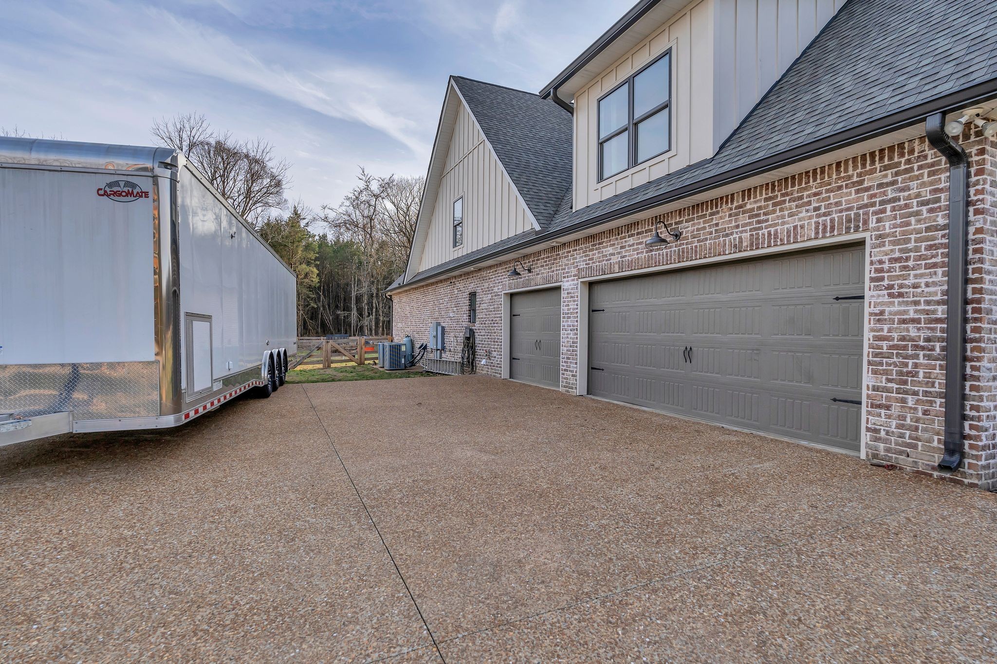 6655 Simmons Bluff Road Lebanon, TN 37090 - Photo 3 of 32 a view of a house with a garage and balcony