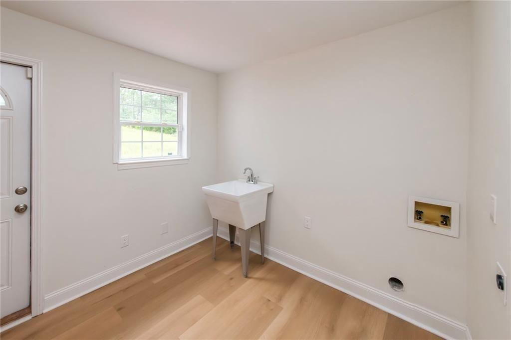 3819 Mason Creek Road Winston, GA 30187 - Photo 24 of 54 a bathroom with a sink and a window