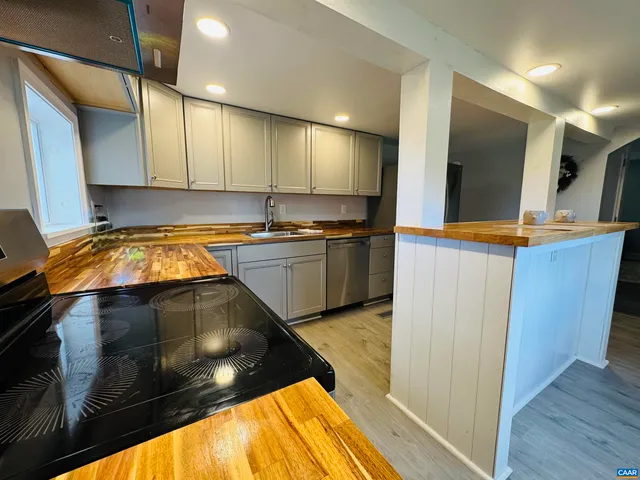a kitchen with stainless steel appliances a refrigerator and a stove