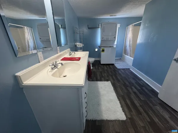 an aerial view of a house with a yard and garden