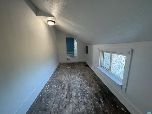 a view of a refrigerator in kitchen and window