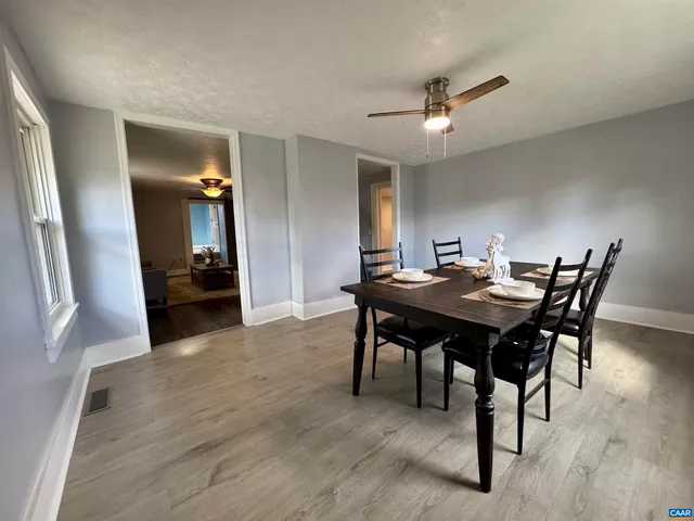 a kitchen with stainless steel appliances granite countertop a refrigerator and a stove