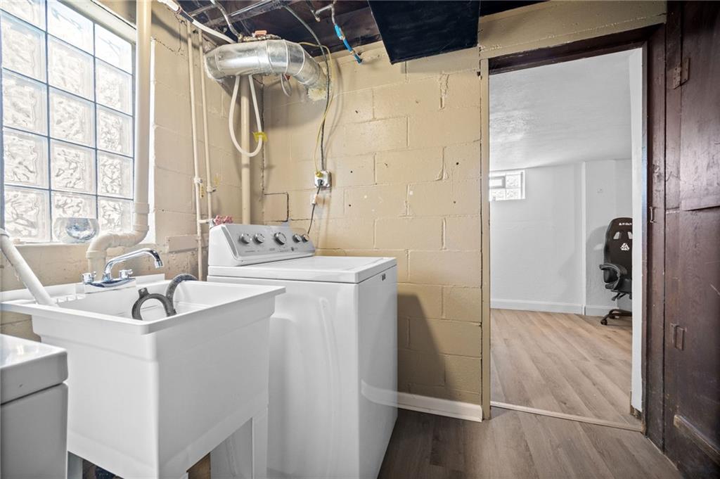 4030 Lebanon Church Road West Mifflin, PA 15122 - Photo 36 of 45 a bathroom with a sink a mirror and a shower