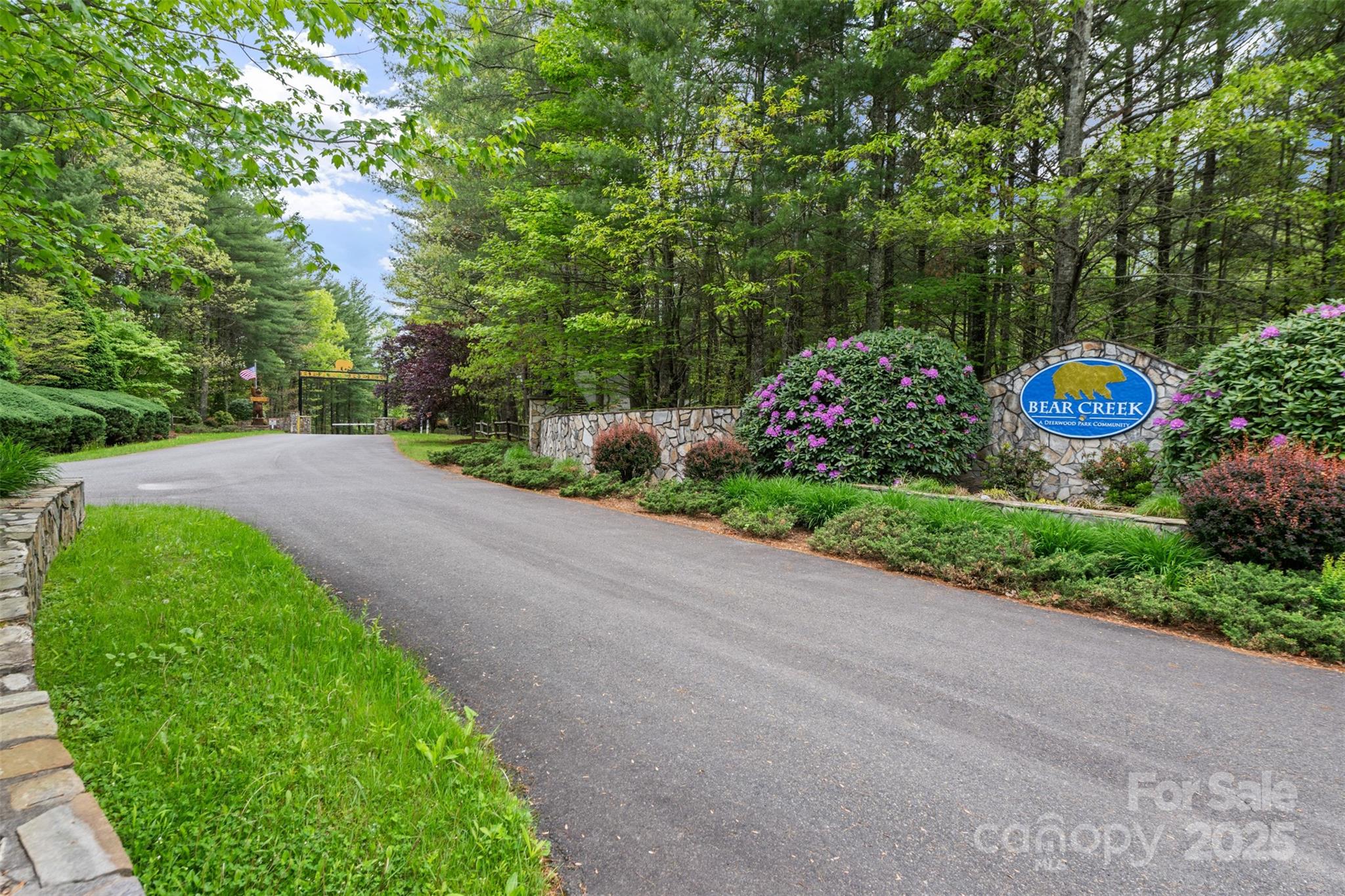 29 Pond View Lane, Unit 29 Sparta, NC 28675 - Photo 29 of 30 a sign that is sitting in the middle of a garden