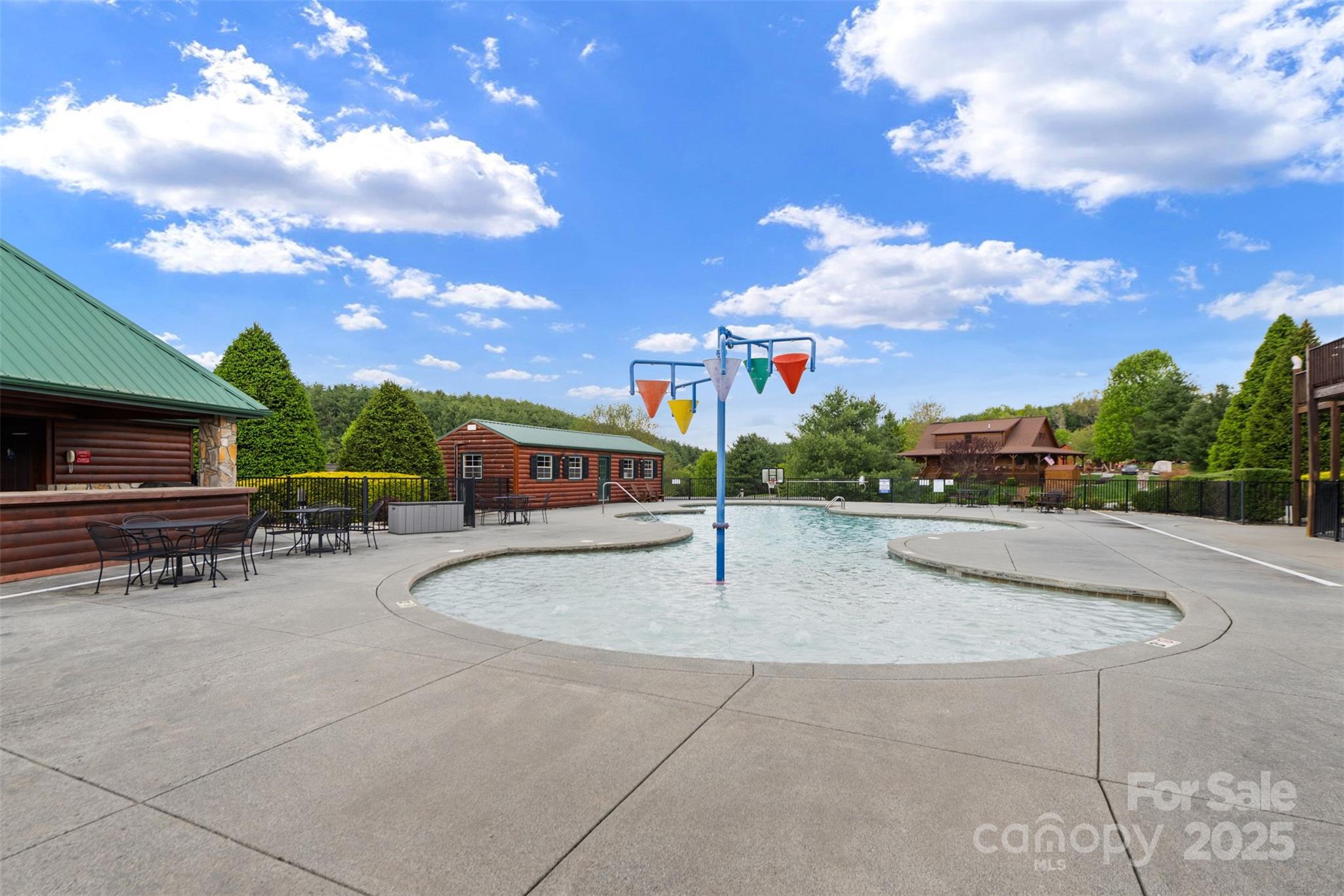 29 Pond View Lane, Unit 29 Sparta, NC 28675 - Photo 7 of 30 a swimming pool with outdoor seating