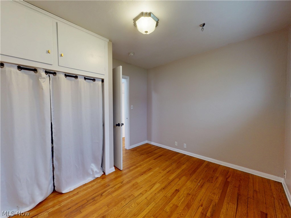 162 South Leavitt Road Amherst, OH 44001 - Photo 19 of 41 Unfurnished bedroom featuring a closet and light wood-style floors