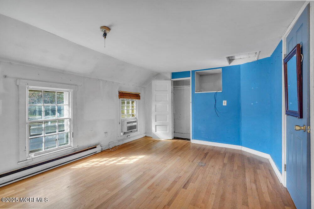 22 Lacey Road Forked River, NJ 08731 - Photo 13 of 24 a view of empty room with wooden floor and fan