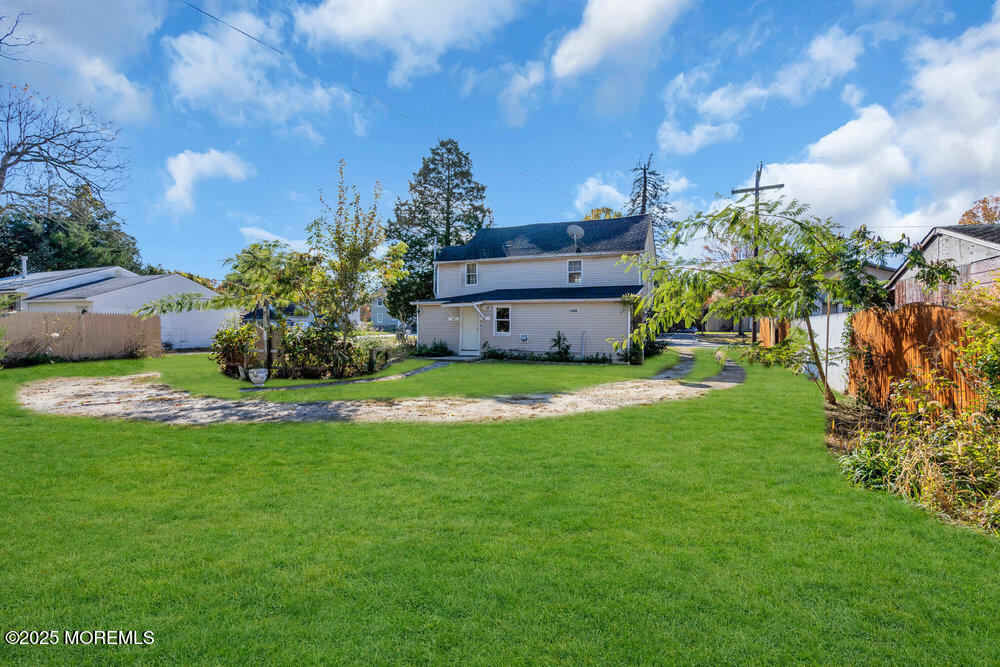 22 Lacey Road Forked River, NJ 08731 - Photo 16 of 24 a view of a house with a yard and a garden