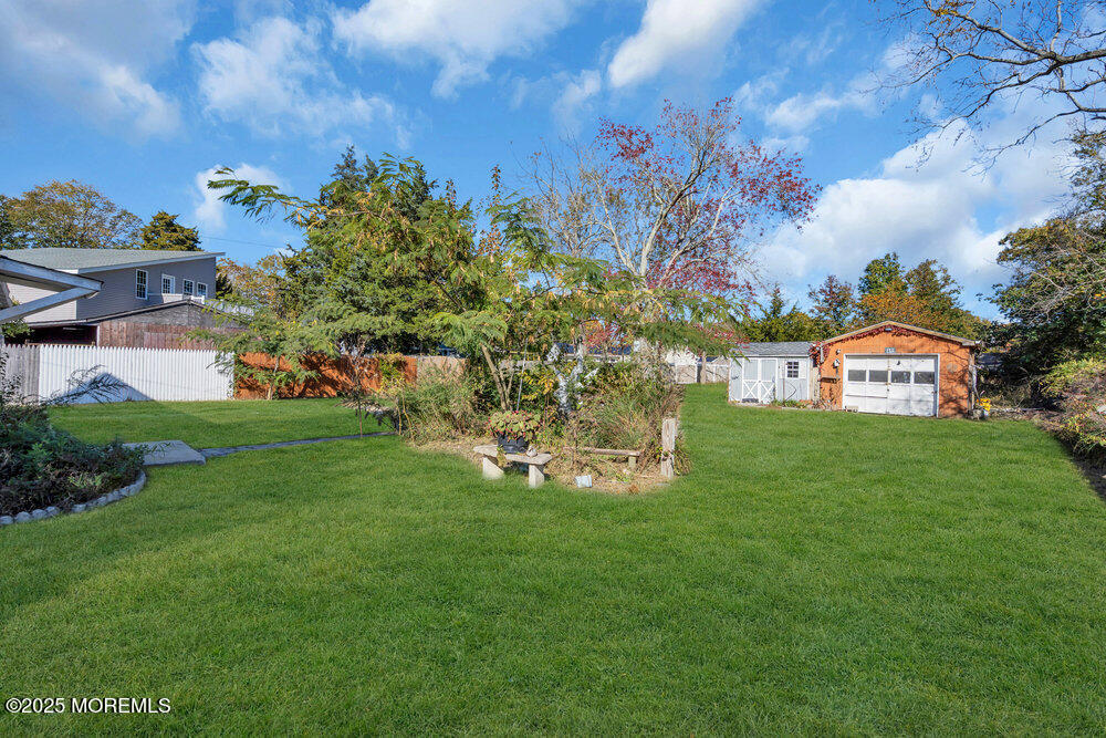 22 Lacey Road Forked River, NJ 08731 - Photo 17 of 24 a view of a big house with a big yard and large trees